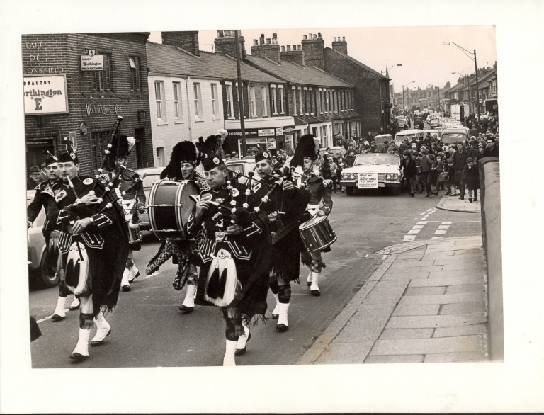 Band passing the Earl of Beaconsfield